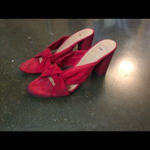 Red platform velvet heels with bow tie detail